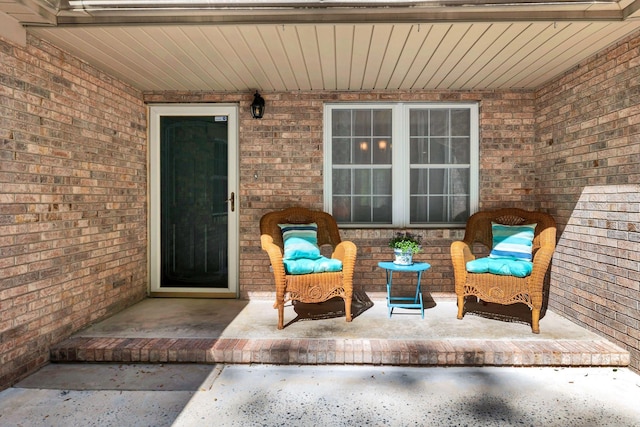 property entrance featuring brick siding