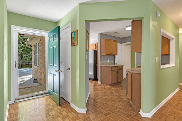 corridor featuring baseboards
