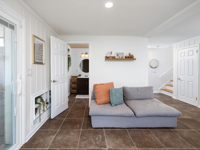 living room with stairs, dark tile patterned flooring, and recessed lighting