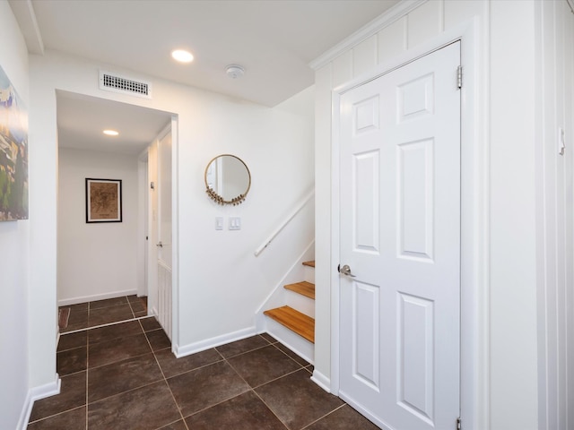 stairway with recessed lighting, visible vents, tile patterned floors, and baseboards