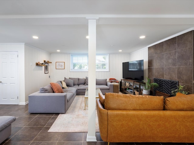 living room with ornamental molding, dark tile patterned flooring, and recessed lighting