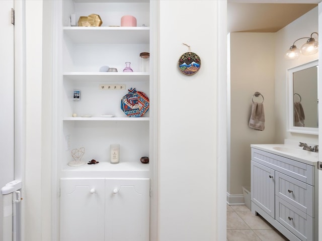 bathroom featuring vanity, tile patterned flooring, and built in shelves