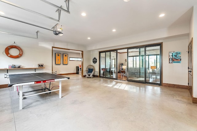 rec room featuring baseboards, finished concrete floors, and recessed lighting