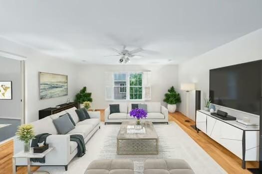 living room featuring ceiling fan and wood finished floors