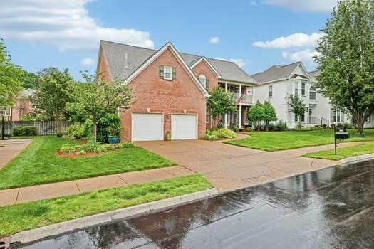 view of front facade featuring concrete driveway, a garage, and brick siding