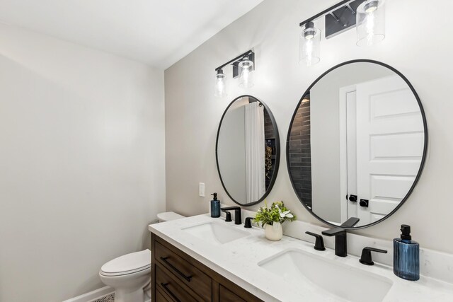 4052 Kings Ln, Nashville, TN 37218 - bathroom with double vanity, toilet, and a sink