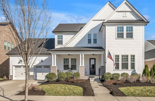 view of front of property featuring a shingled roof, concrete driveway, ceiling fan, a porch, and a garage