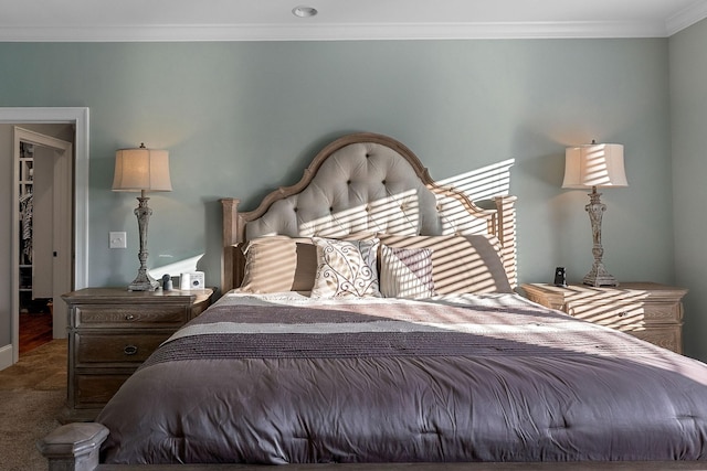 carpeted bedroom with ornamental molding