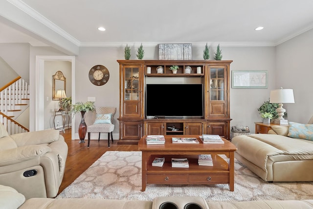 living room featuring wood finished floors, recessed lighting, stairway, and crown molding