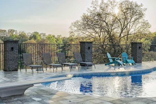 view of pool with a fenced in pool and a patio