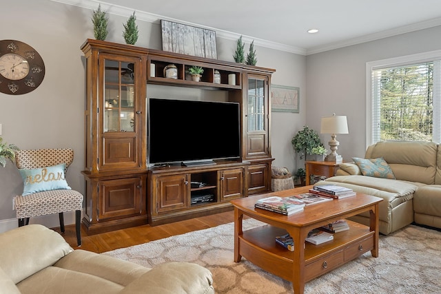 living room featuring recessed lighting, light wood-style flooring, crown molding, and baseboards