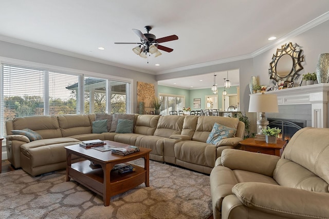 living room with ornamental molding, a ceiling fan, and recessed lighting