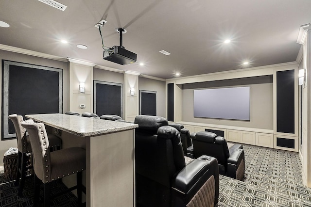 cinema room with recessed lighting, ornamental molding, and a decorative wall