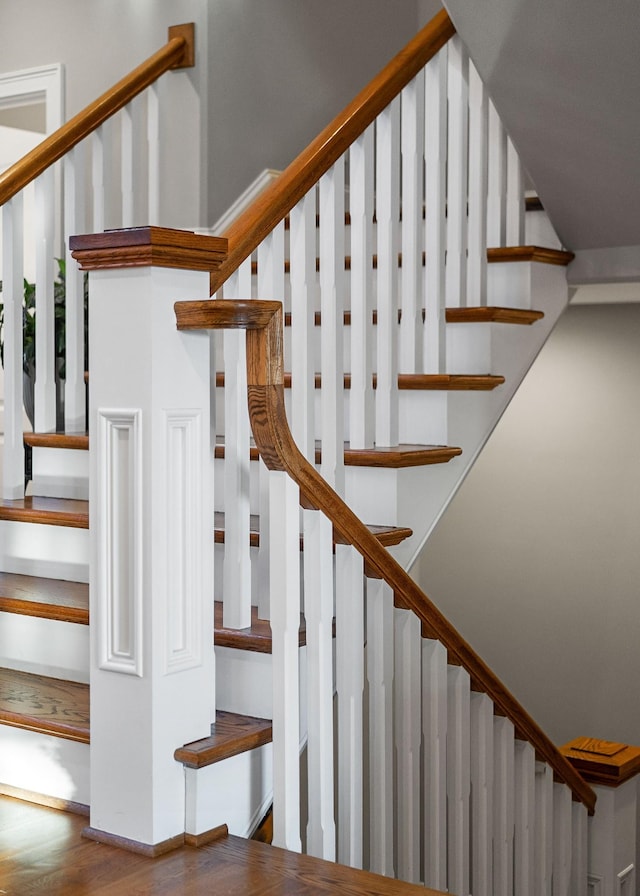 stairs with wood finished floors