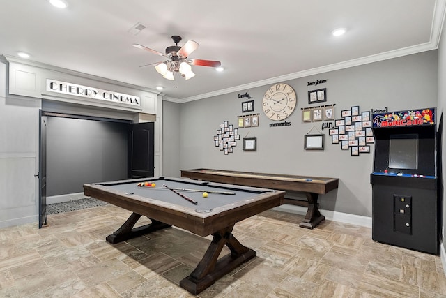 playroom featuring stone tile floors, crown molding, baseboards, and a ceiling fan