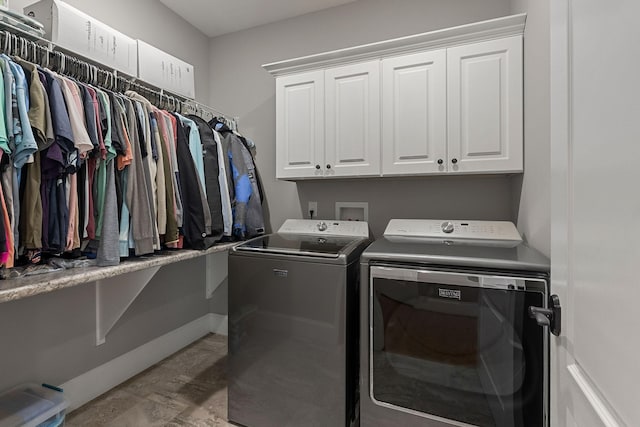 laundry area featuring cabinet space and independent washer and dryer