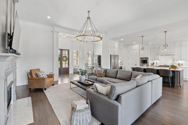 2041 Kingsbarns Dr, Nolensville, TN 37135 - living room with dark wood finished floors, a high end fireplace, a chandelier, and recessed lighting