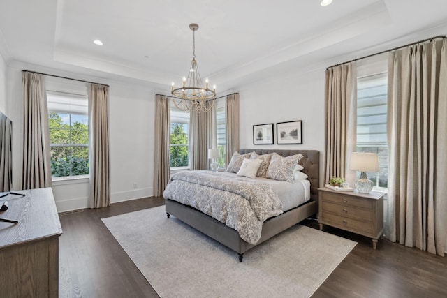 2041 Kingsbarns Dr, Nolensville, TN 37135 - bedroom featuring dark wood-type flooring, a tray ceiling, a chandelier, and multiple windows