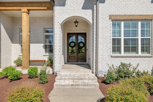 2041 Kingsbarns Dr, Nolensville, TN 37135 - property entrance featuring covered porch, french doors, and brick siding