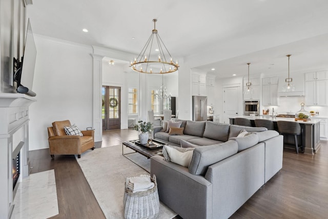 2041 Kingsbarns Dr, Nolensville, TN 37135 - living area with recessed lighting, a high end fireplace, dark wood-type flooring, and a notable chandelier