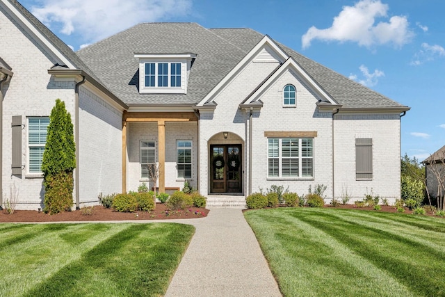 2041 Kingsbarns Dr, Nolensville, TN 37135 - view of front of property with brick siding, french doors, roof with shingles, and a front yard