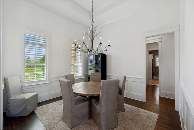 2041 Kingsbarns Dr, Nolensville, TN 37135 - dining area featuring dark wood-style floors, a decorative wall, crown molding, wainscoting, and a notable chandelier