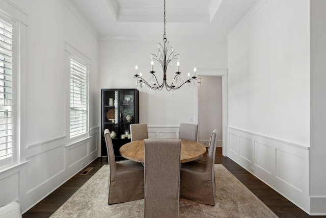 2041 Kingsbarns Dr, Nolensville, TN 37135 - dining space featuring wainscoting, dark wood finished floors, a decorative wall, and a notable chandelier