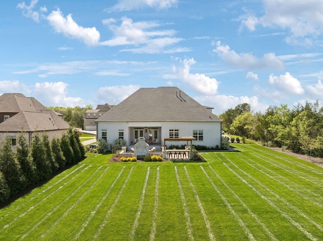 2041 Kingsbarns Dr, Nolensville, TN 37135 - rear view of property featuring a lawn and a patio area