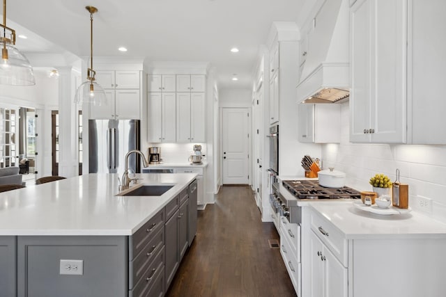 2041 Kingsbarns Dr, Nolensville, TN 37135 - kitchen with stainless steel appliances, a sink, gray cabinets, light countertops, and premium range hood