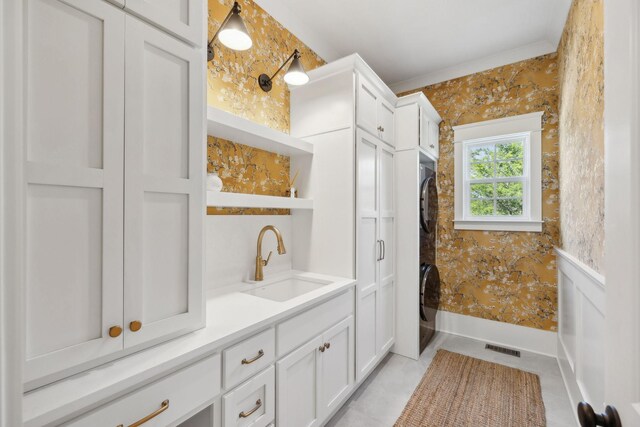 2041 Kingsbarns Dr, Nolensville, TN 37135 - bathroom with vanity, baseboards, stacked washer / dryer, and visible vents