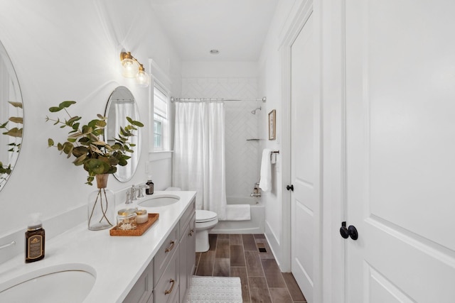 2041 Kingsbarns Dr, Nolensville, TN 37135 - bathroom with a sink, double vanity, toilet, shower / tub combo with curtain, and wood finished floors