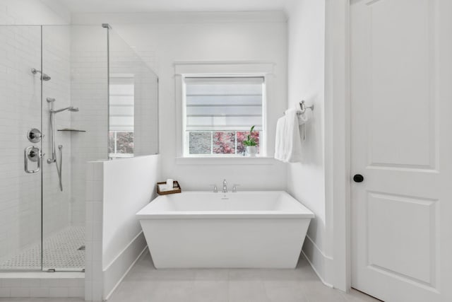 2041 Kingsbarns Dr, Nolensville, TN 37135 - bathroom with a freestanding bath, baseboards, tile patterned floors, and a stall shower