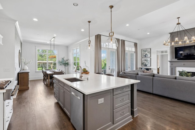 2041 Kingsbarns Dr, Nolensville, TN 37135 - kitchen featuring stainless steel dishwasher, a sink, light countertops, gray cabinetry, and dark wood-style floors