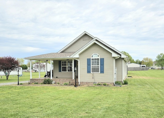 view of front of property with a porch and a front lawn