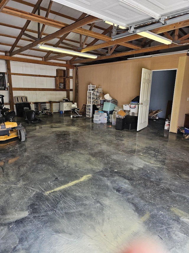 garage featuring wooden walls