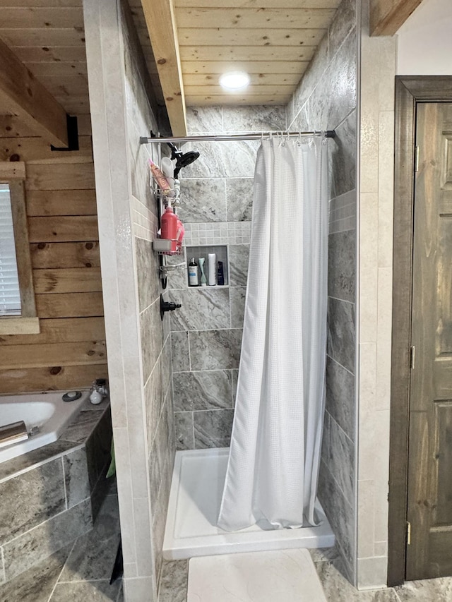bathroom with a shower stall, wooden ceiling, a garden tub, and wood walls