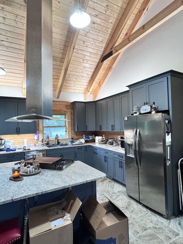 kitchen featuring beam ceiling, appliances with stainless steel finishes, and wooden ceiling