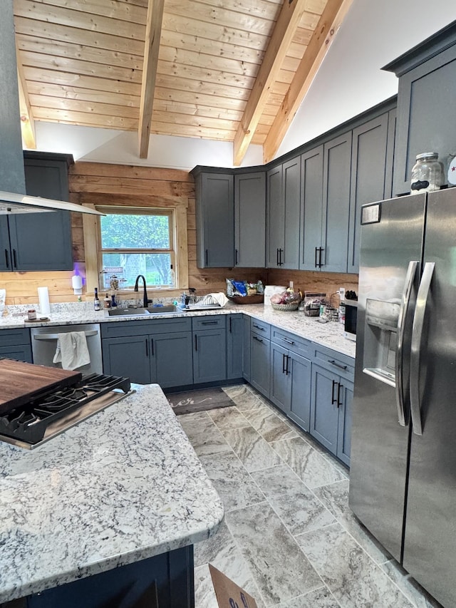 kitchen featuring appliances with stainless steel finishes, wood ceiling, light stone counters, and a sink