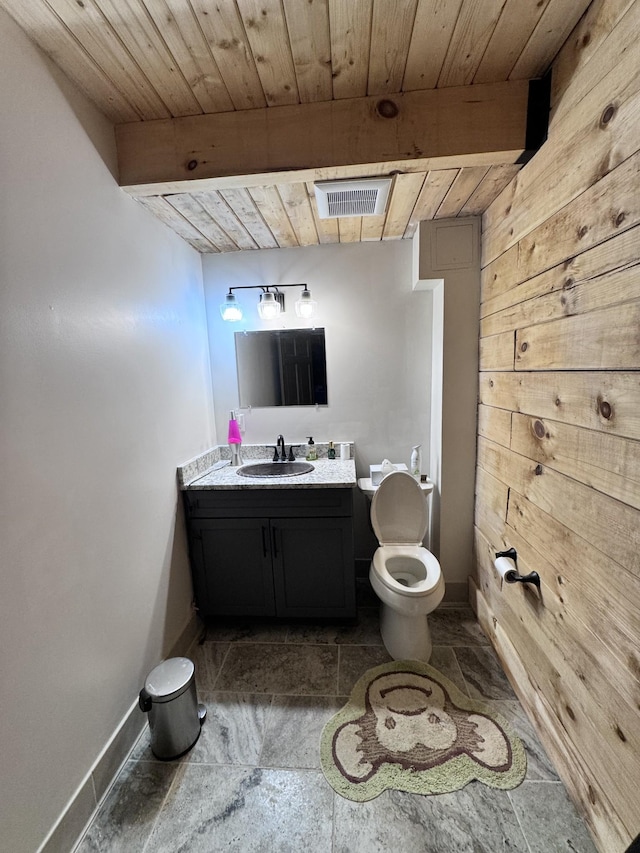 bathroom with visible vents, wooden ceiling, baseboards, and vanity