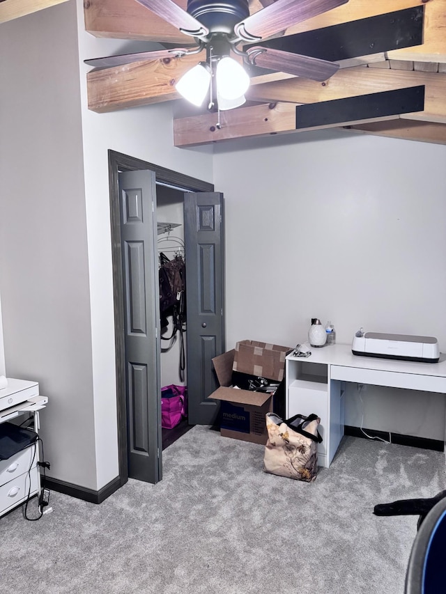 interior space featuring a ceiling fan and baseboards