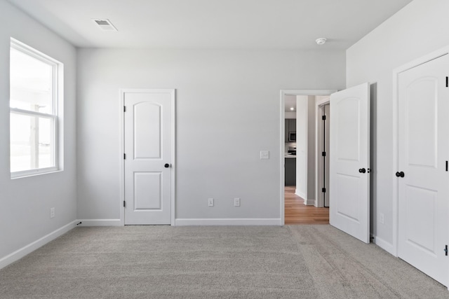 264 Subban Ct, Lebanon, TN 37087 - unfurnished bedroom featuring visible vents, baseboards, and light colored carpet