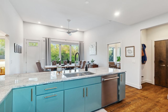 kitchen featuring dark wood-type flooring, dishwasher, plenty of natural light, and a sink
