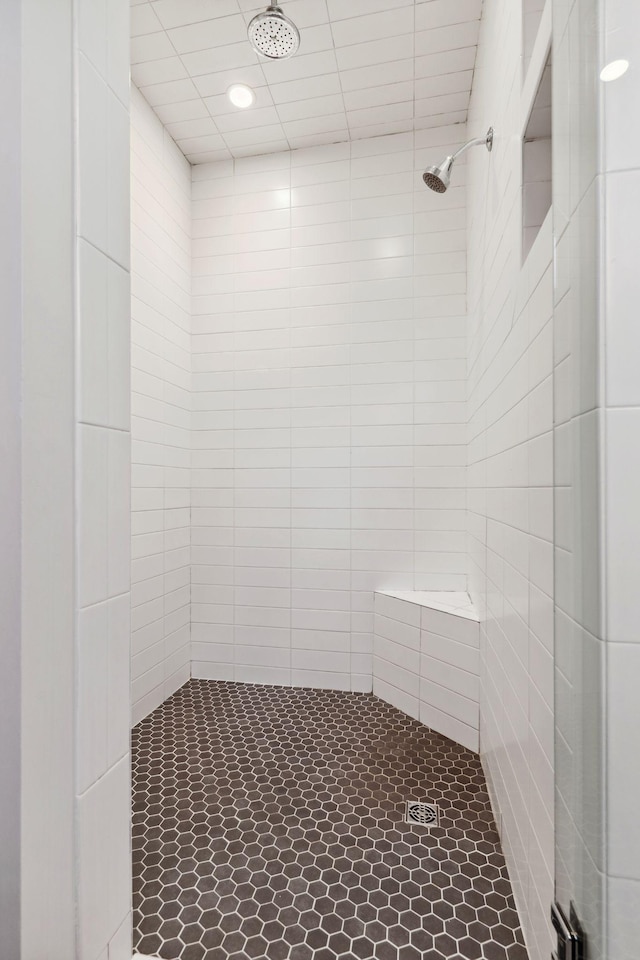 bathroom with tiled shower