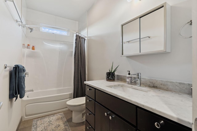 full bath featuring vanity, toilet, and shower / bath combo