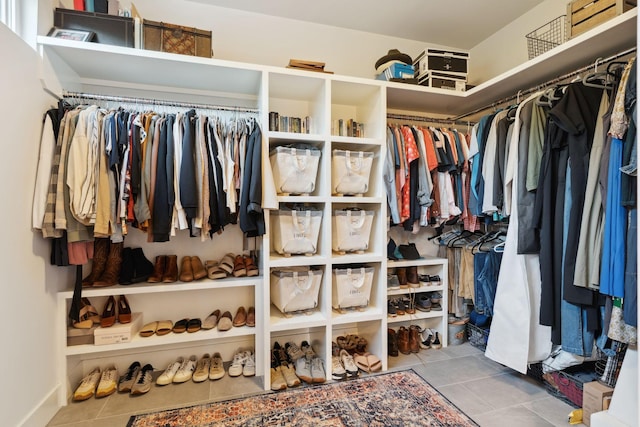 spacious closet featuring tile patterned floors
