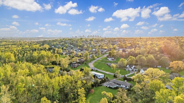 birds eye view of property with a wooded view
