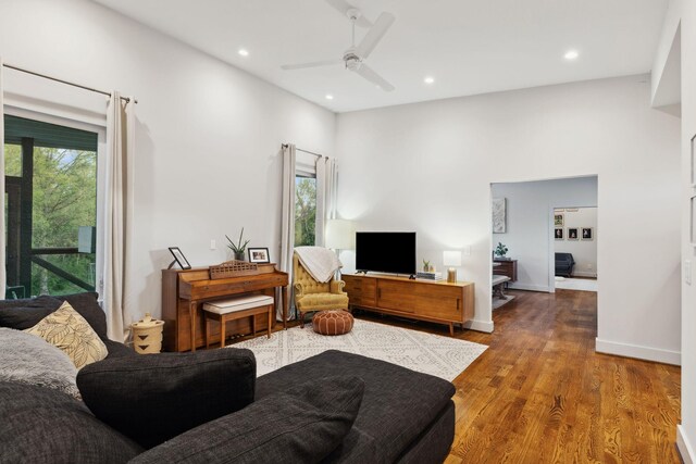 living room with recessed lighting, wood finished floors, a ceiling fan, and baseboards