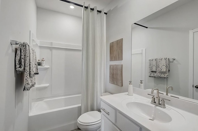 bathroom with shower / bath combo, vanity, and toilet