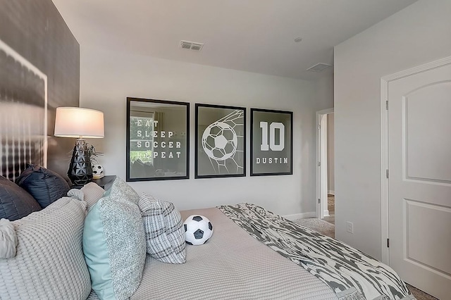bedroom with carpet floors and visible vents