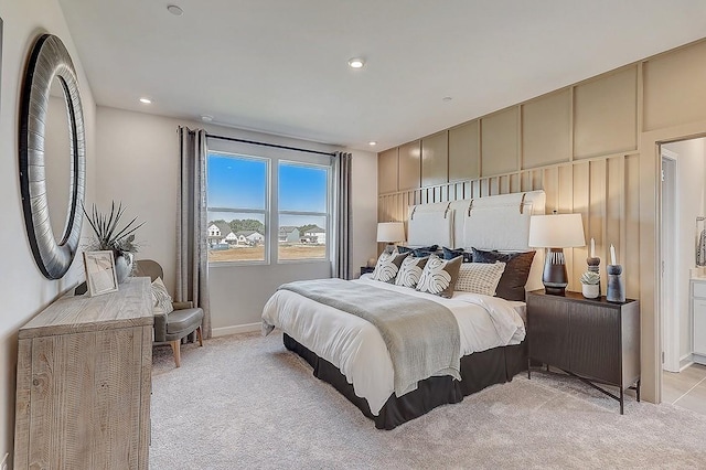 bedroom featuring recessed lighting, light carpet, and baseboards